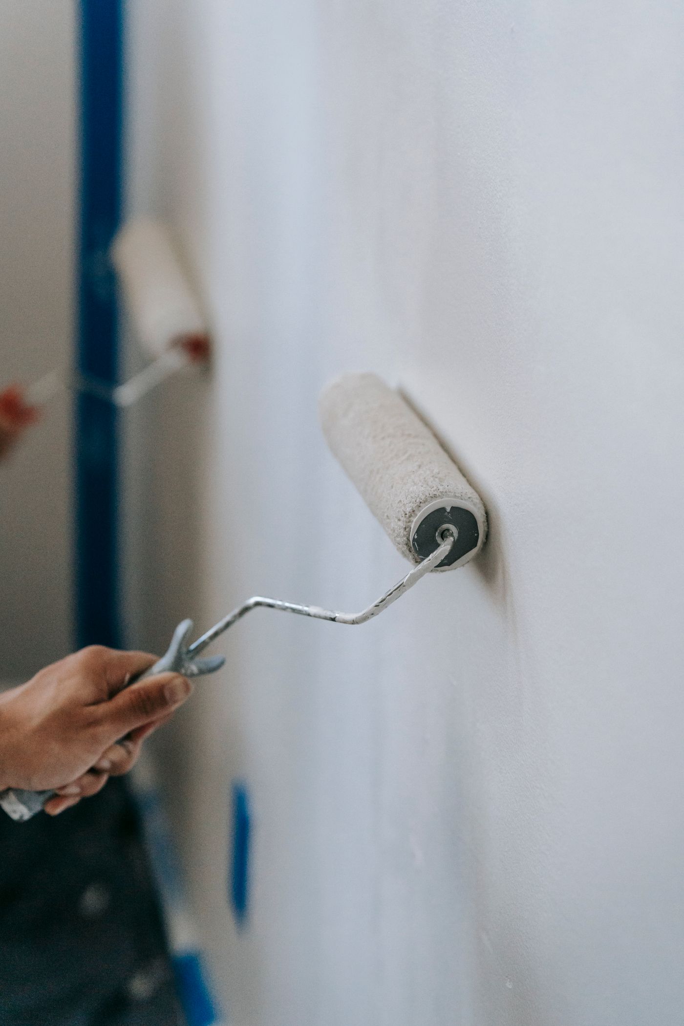 Painter working on an interior wall